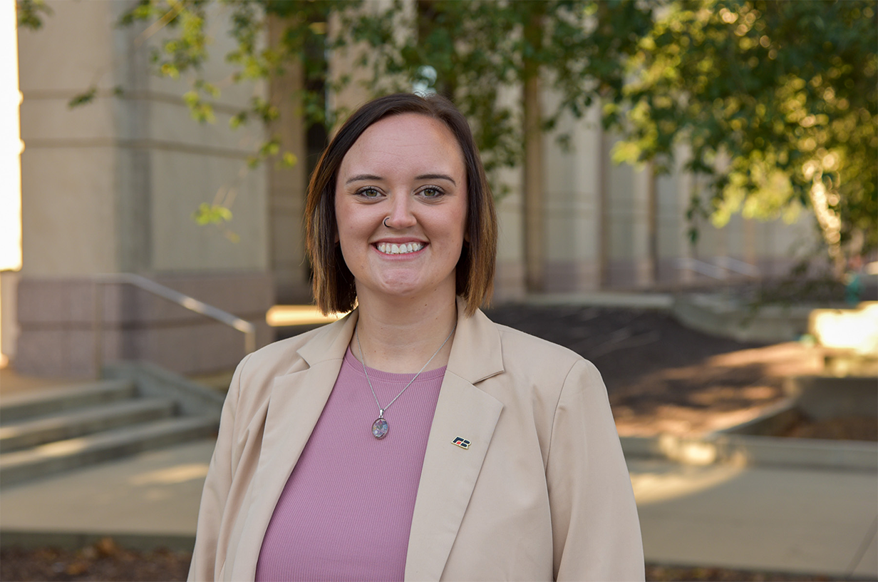 Woman smiling at the camera.