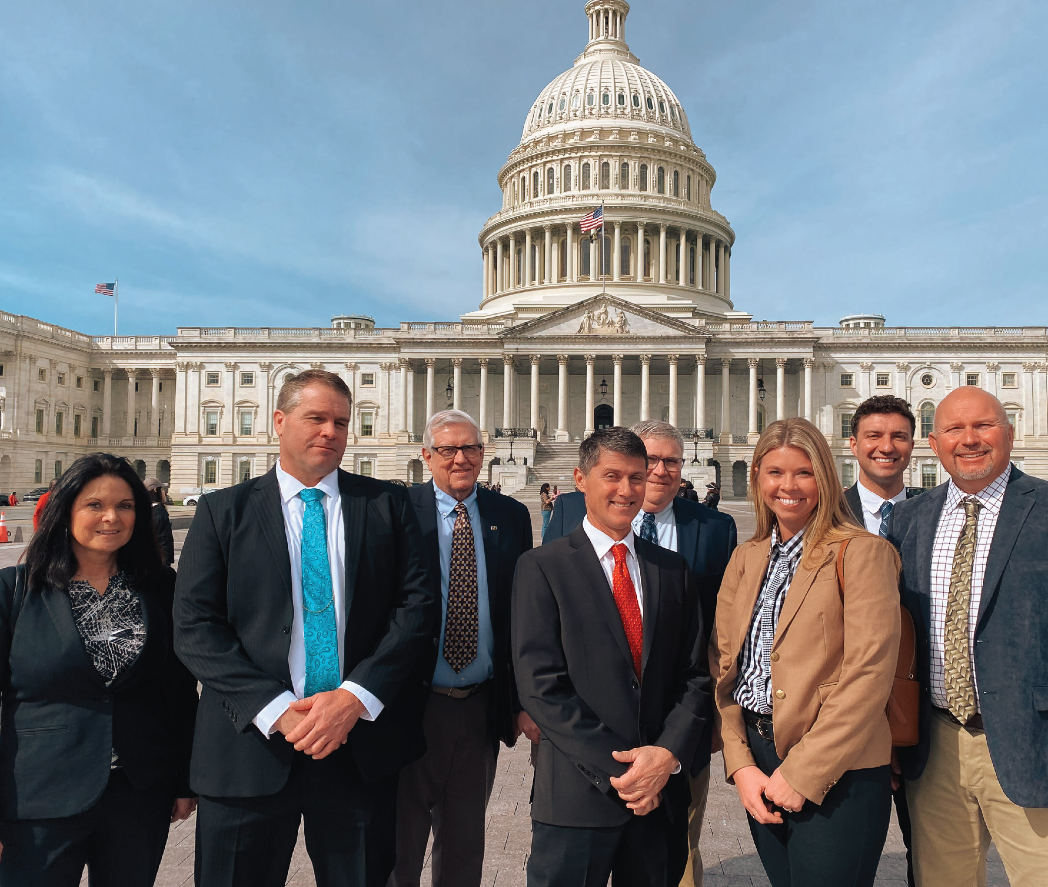 A group of Indiana Farm Bureau members stand in front of the United States Capitol Building.