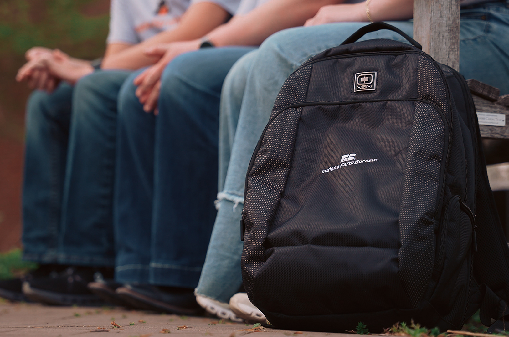 A black backpack with the Indiana Farm Bureau logo on it.